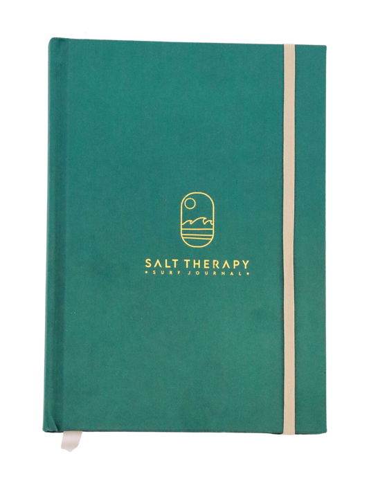 Green hard bound journal with gold embossed logo and tan ribbon marker and elastic.